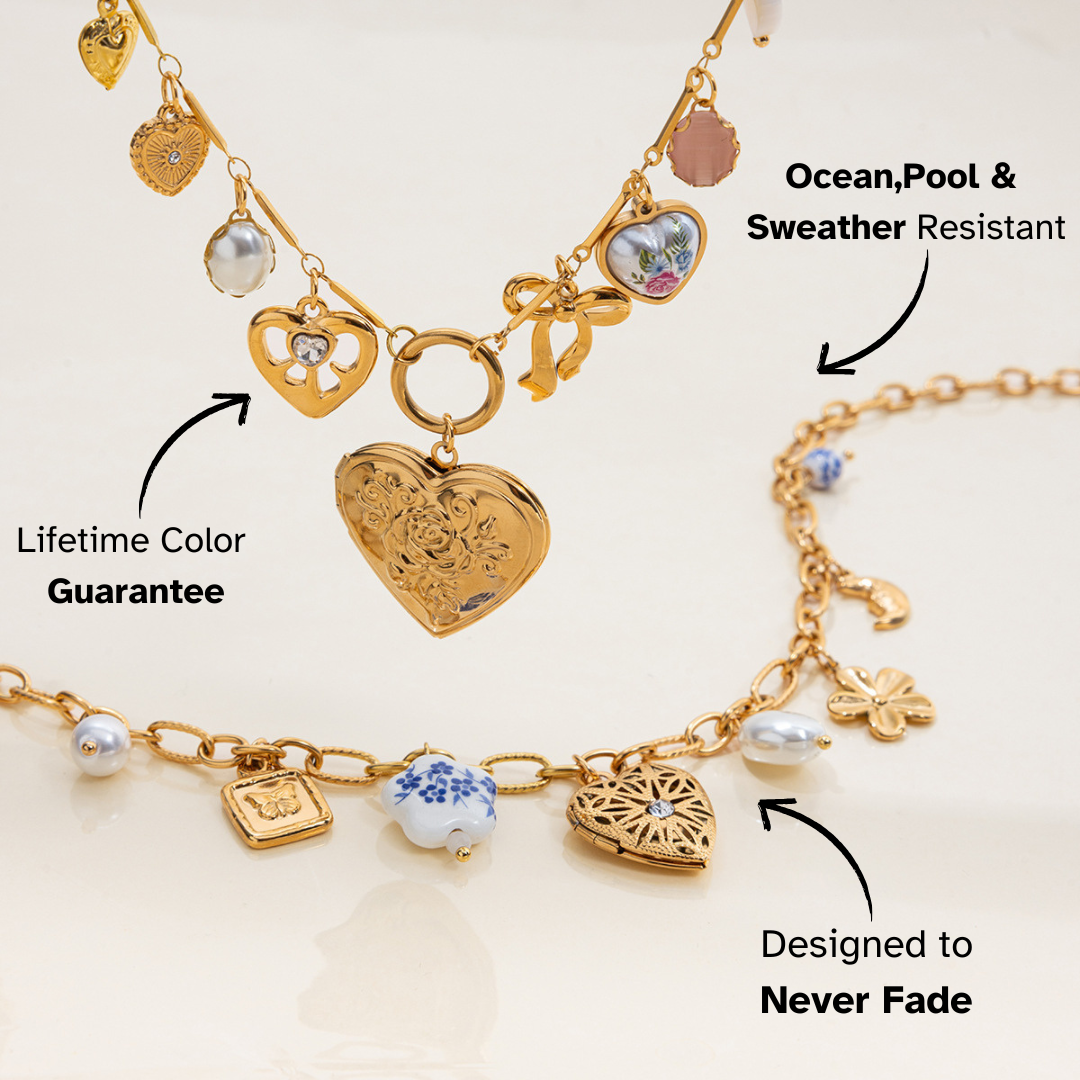 Layered gold necklaces with vintage heart and pearl charms displayed on beige background