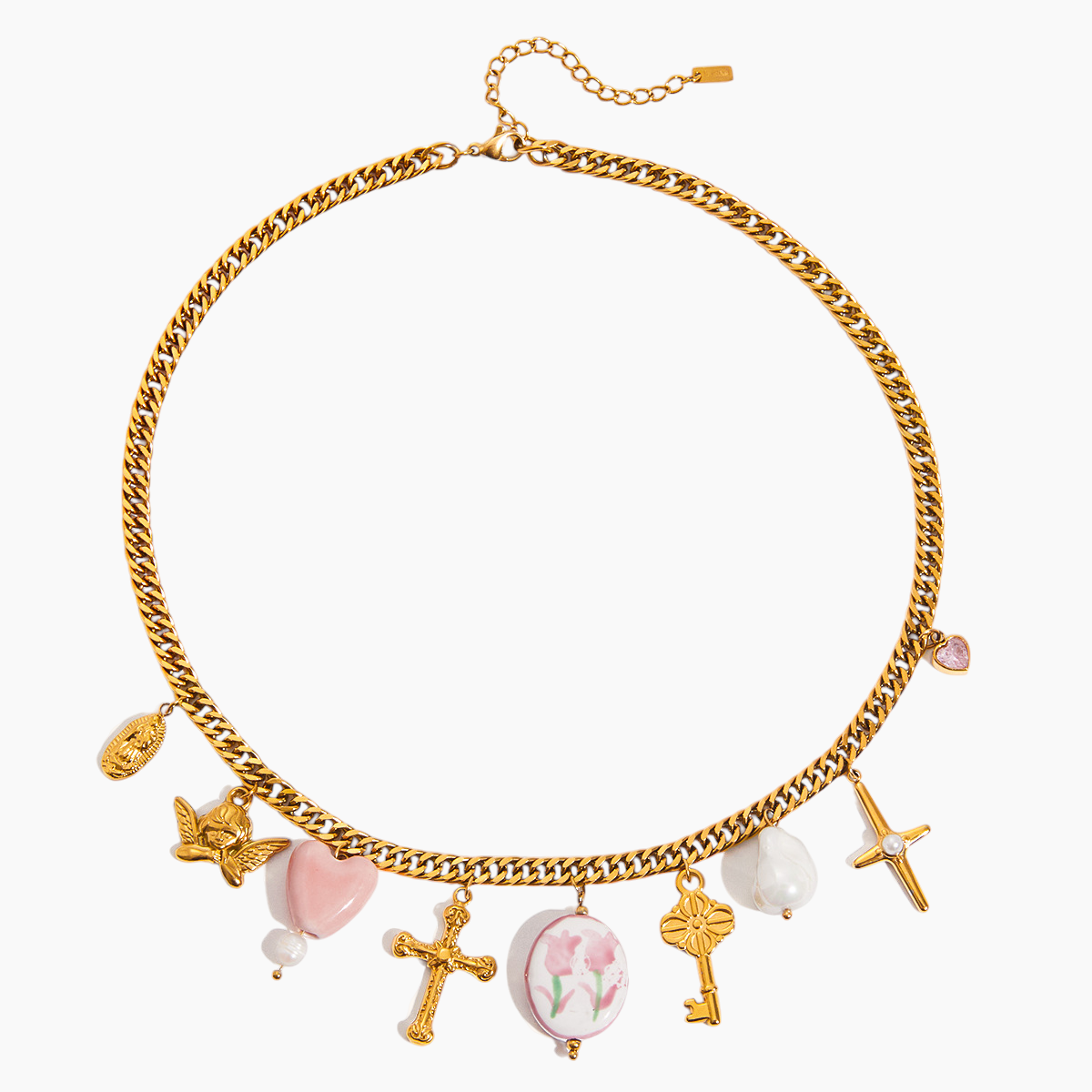 Gold chain necklace with various charms on a white background