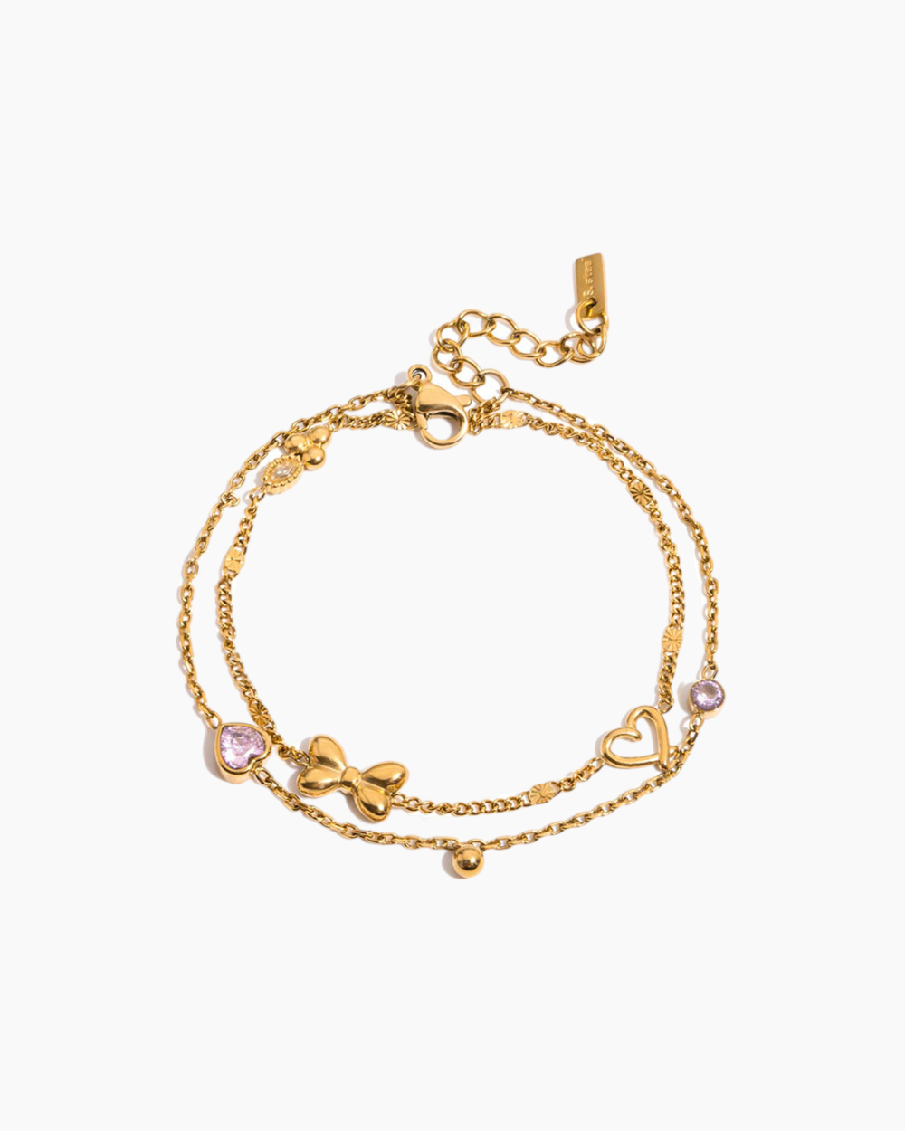Gold bracelet with heart and bow designs on a white background