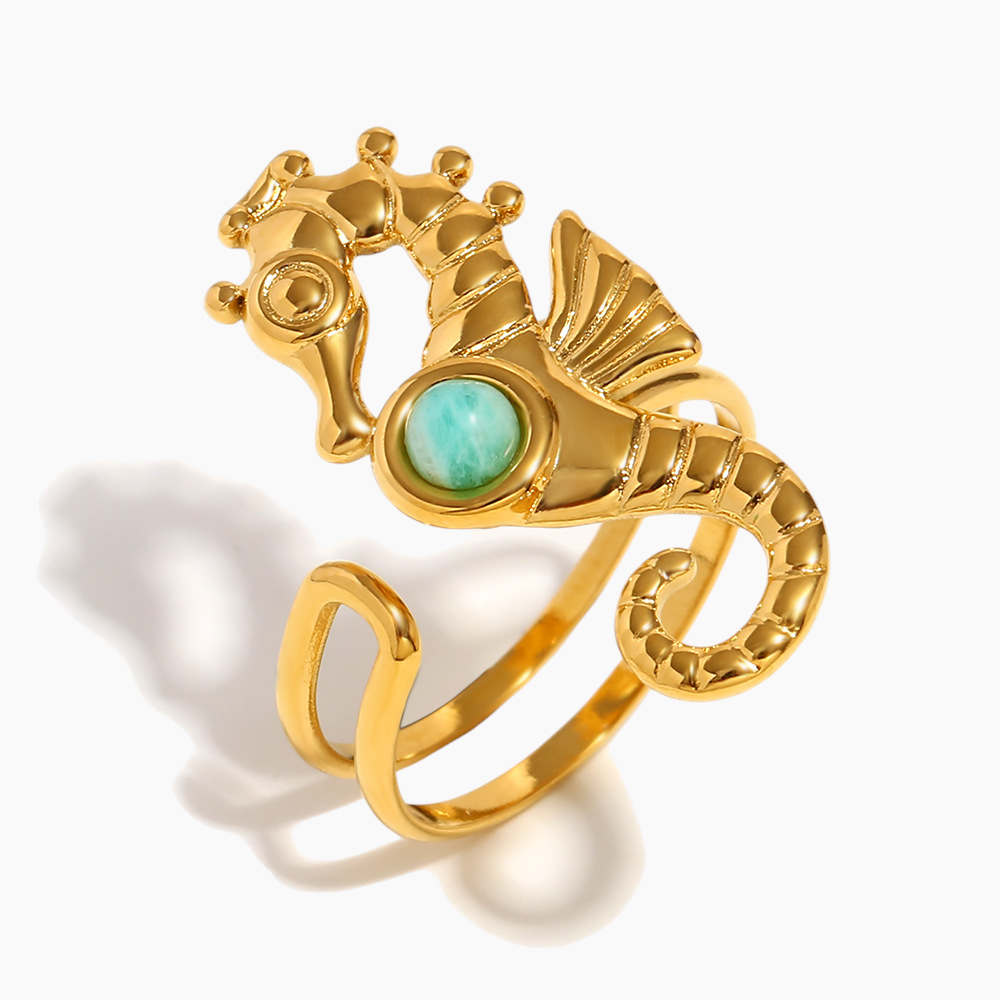 Close-up of seahorse serenity ring with gold coastal-inspired details