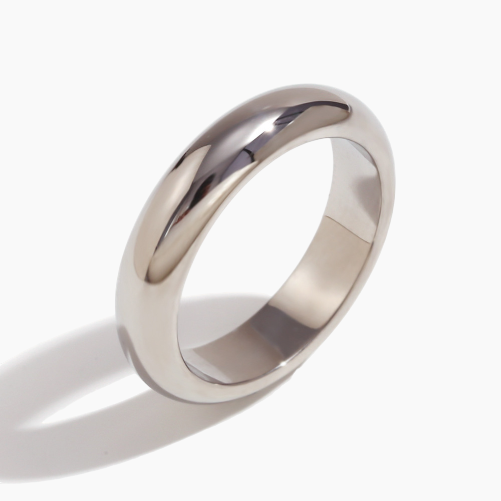 Sleek dome band ring paired with marble background for clean aesthetic