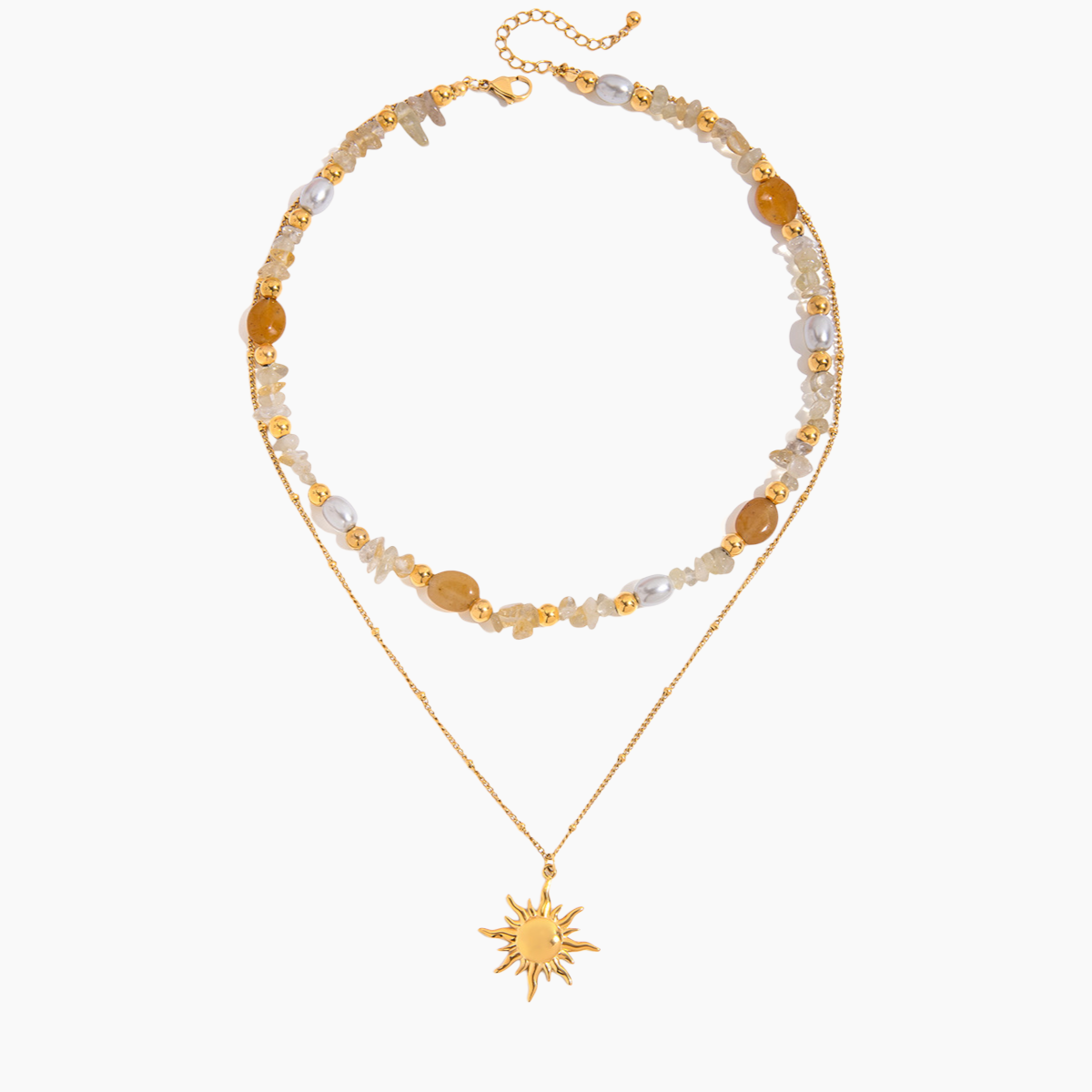 Two layered necklaces with sun pendant and beaded chain on a white background