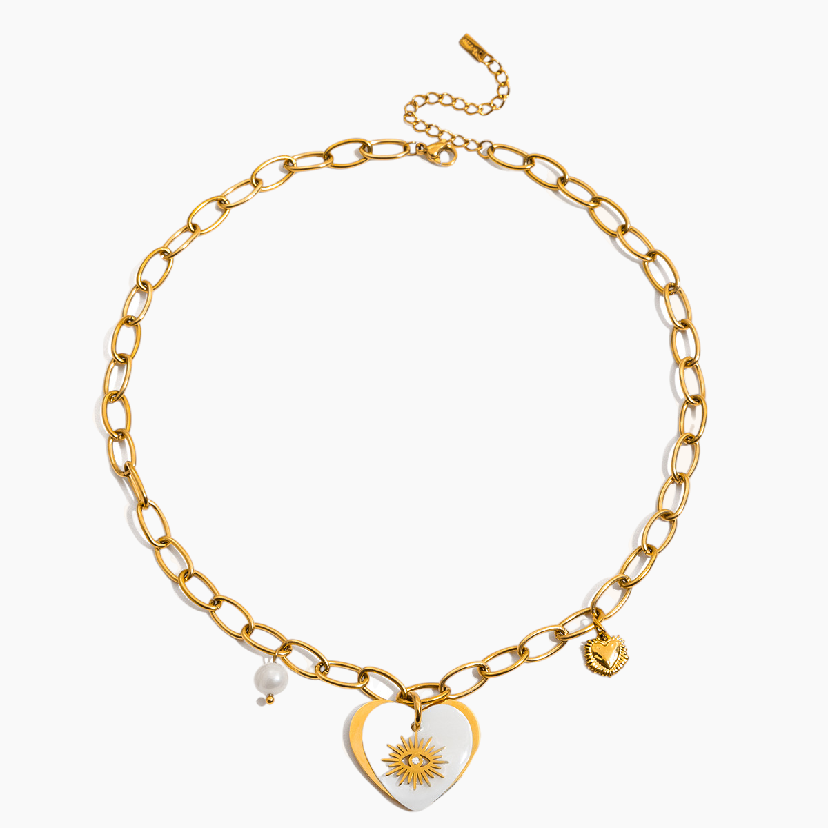 Gold chain necklace with heart-shaped pendant and sun design on a white background