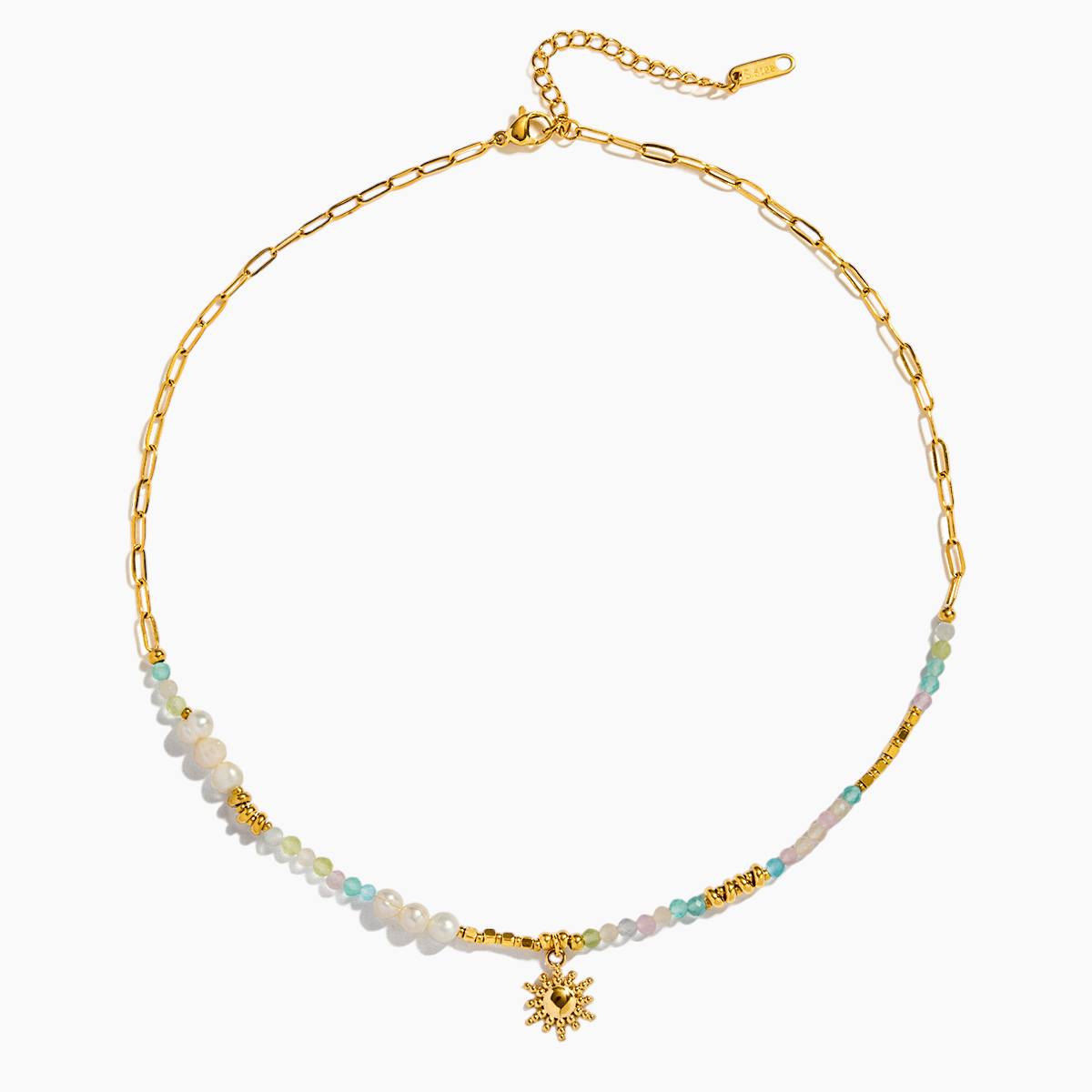 Gold necklace with beaded chain and flower pendant on a white background