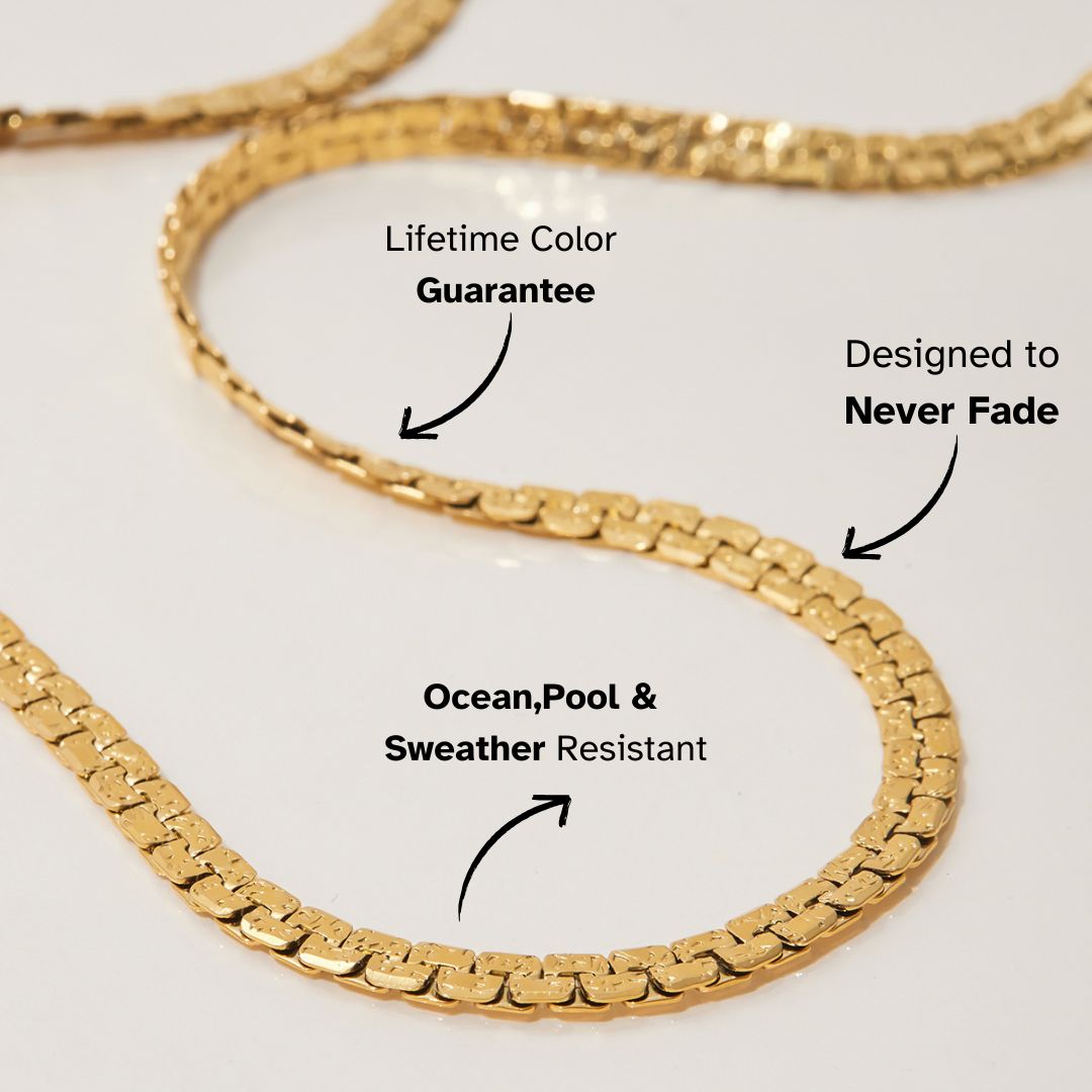 Close-up of waterproof herringbone chain necklace with sleek gold texture