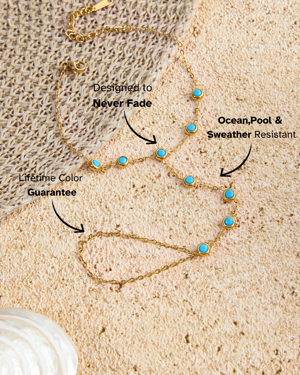 Gold necklace with blue stones on a sandy background