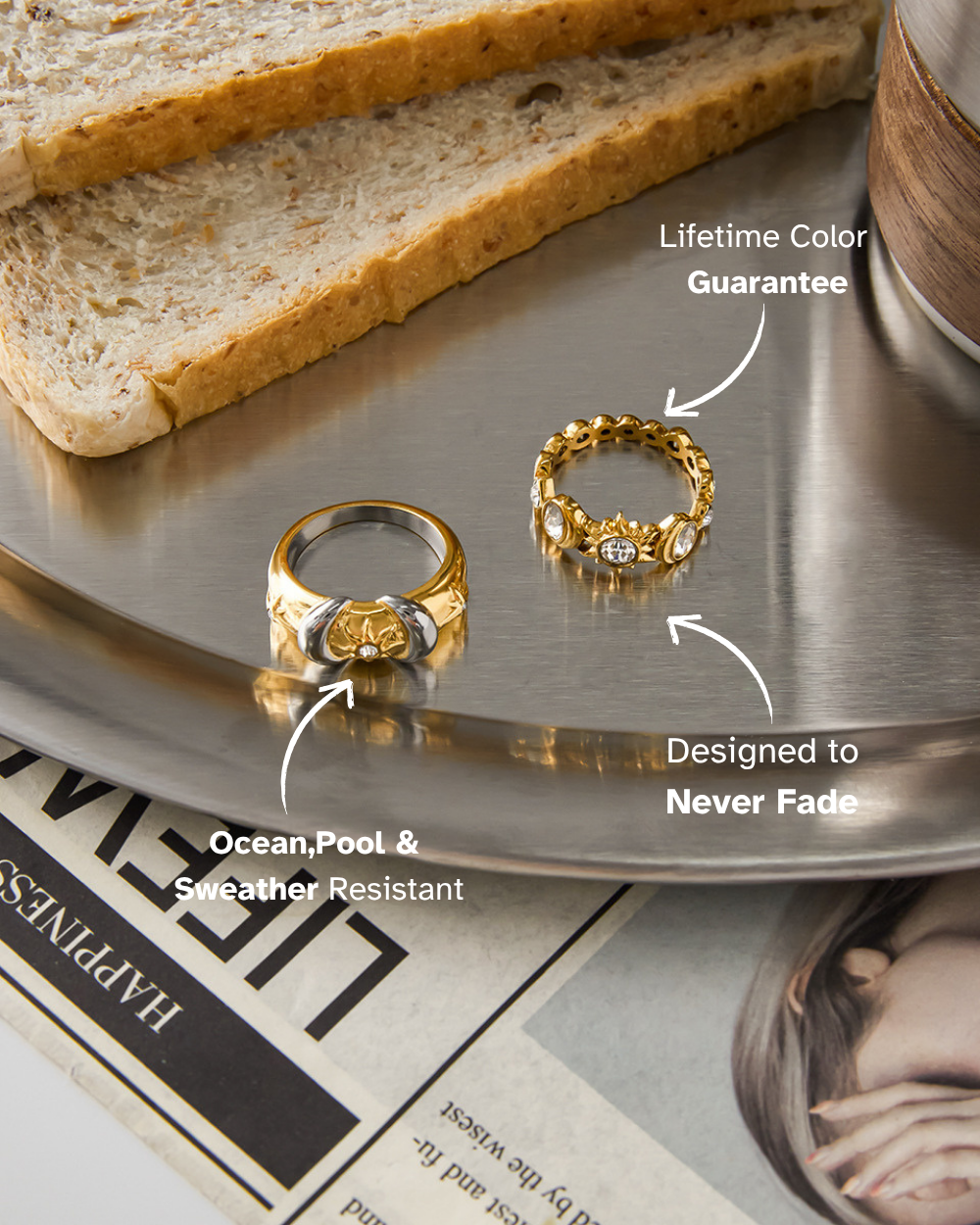 Two gold rings on a metallic surface with text about color guarantee and resistance to weather.
