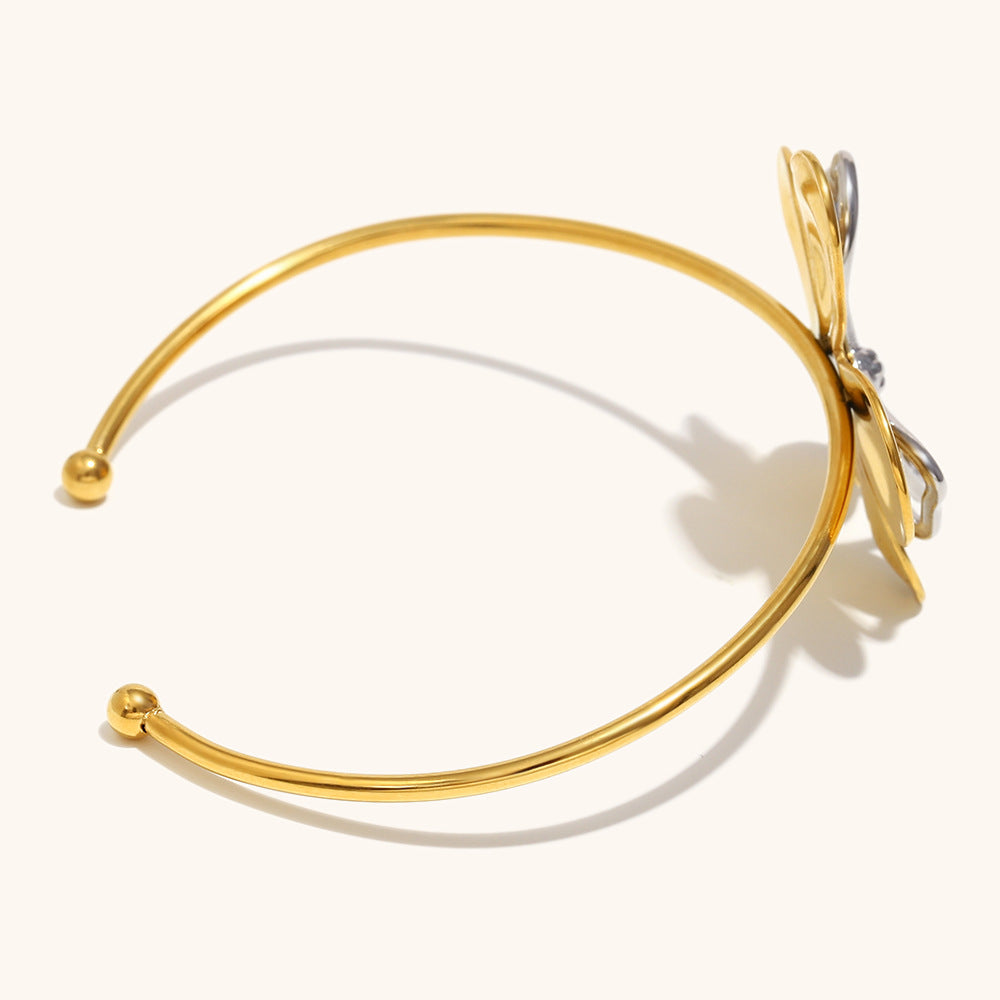Elegant floral cuff bracelet with metallic shine, ideal for spring outfits