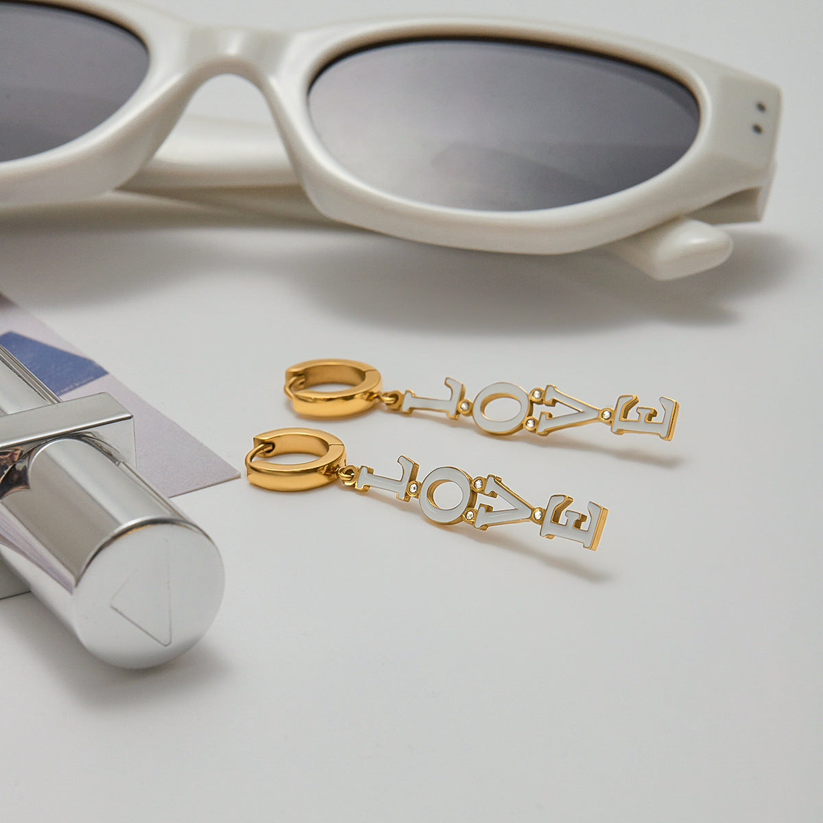 Golden LOVE dangle earrings styled with a casual white tee_MiFJewelry