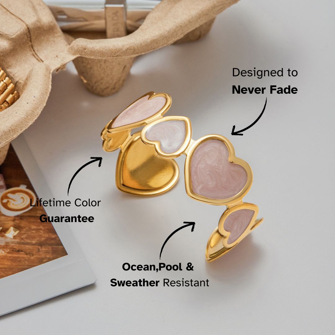 romantic gold open bangle featuring pink enamel hearts