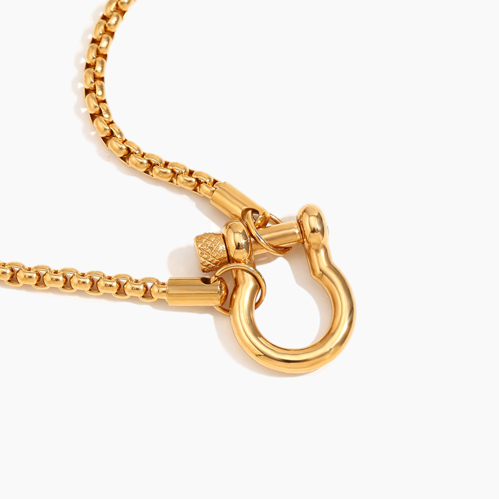 Gold necklace with a clasp on a white background