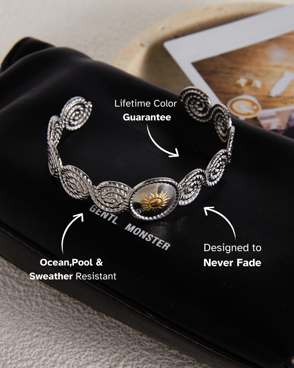 Silver bracelet with text highlighting features on a black surface