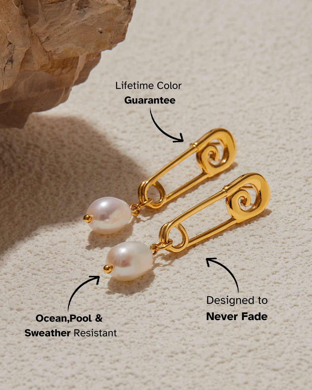Gold earrings with pearl drops on a textured beige surface, featuring text about color guarantee and weather resistance.