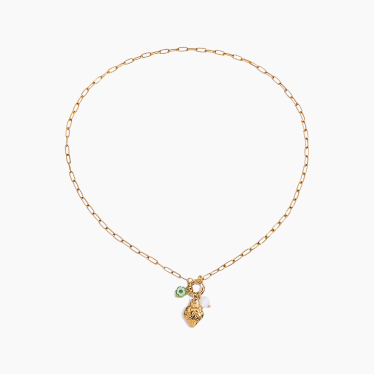 Gold necklace with a small green pendant on a white background
