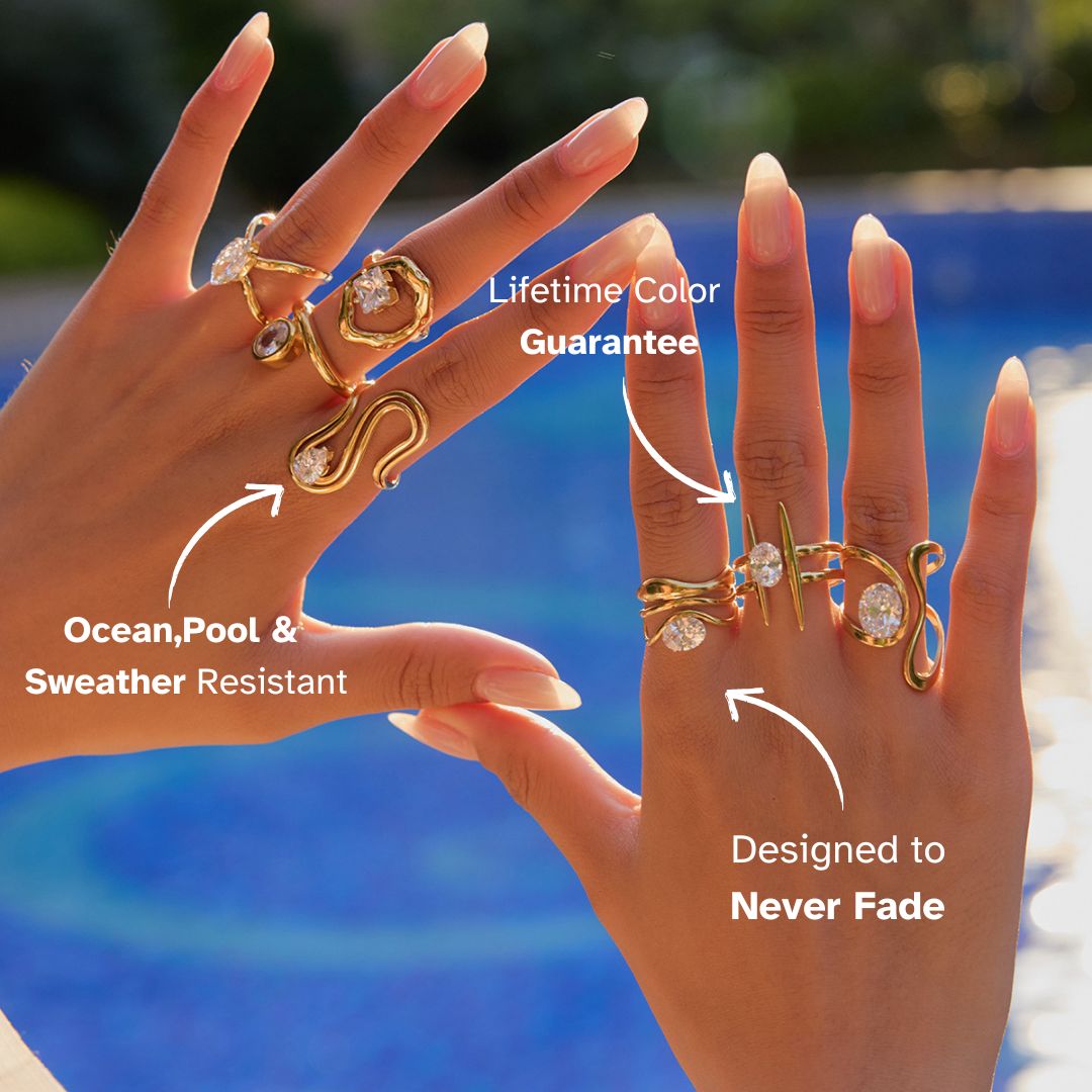 Hand wearing multiple gold rings by the pool, sunlight reflecting on jewelry