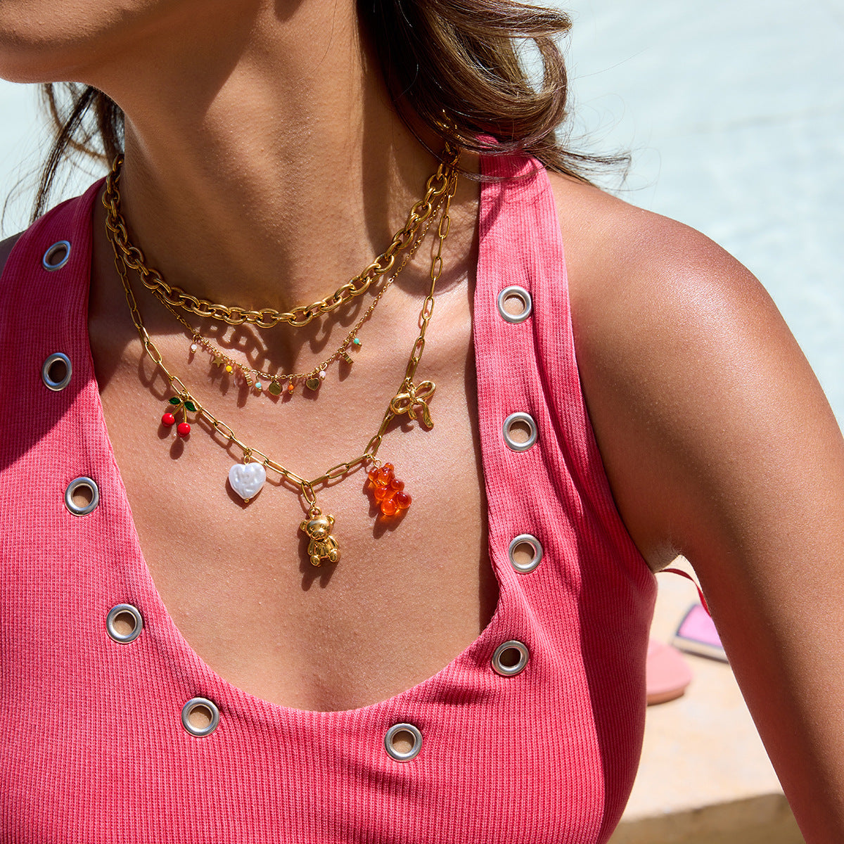 close-up of multicolor charm necklace with summer outfit