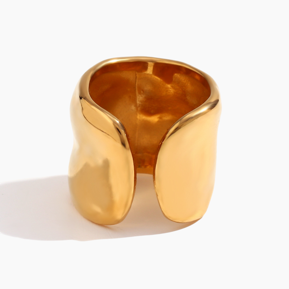 Elegant outfit complemented by molten open cuff ring as focal piece