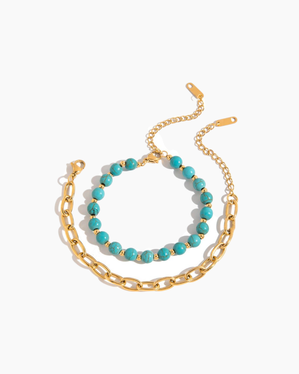 Two bracelets on a white background, one gold chain and one turquoise beads.