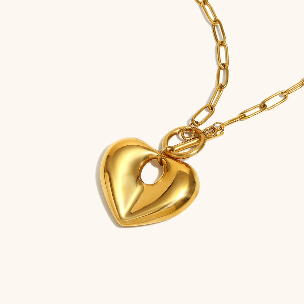 Shiny heart pendant necklace with toggle clasp, perfect for layering looks