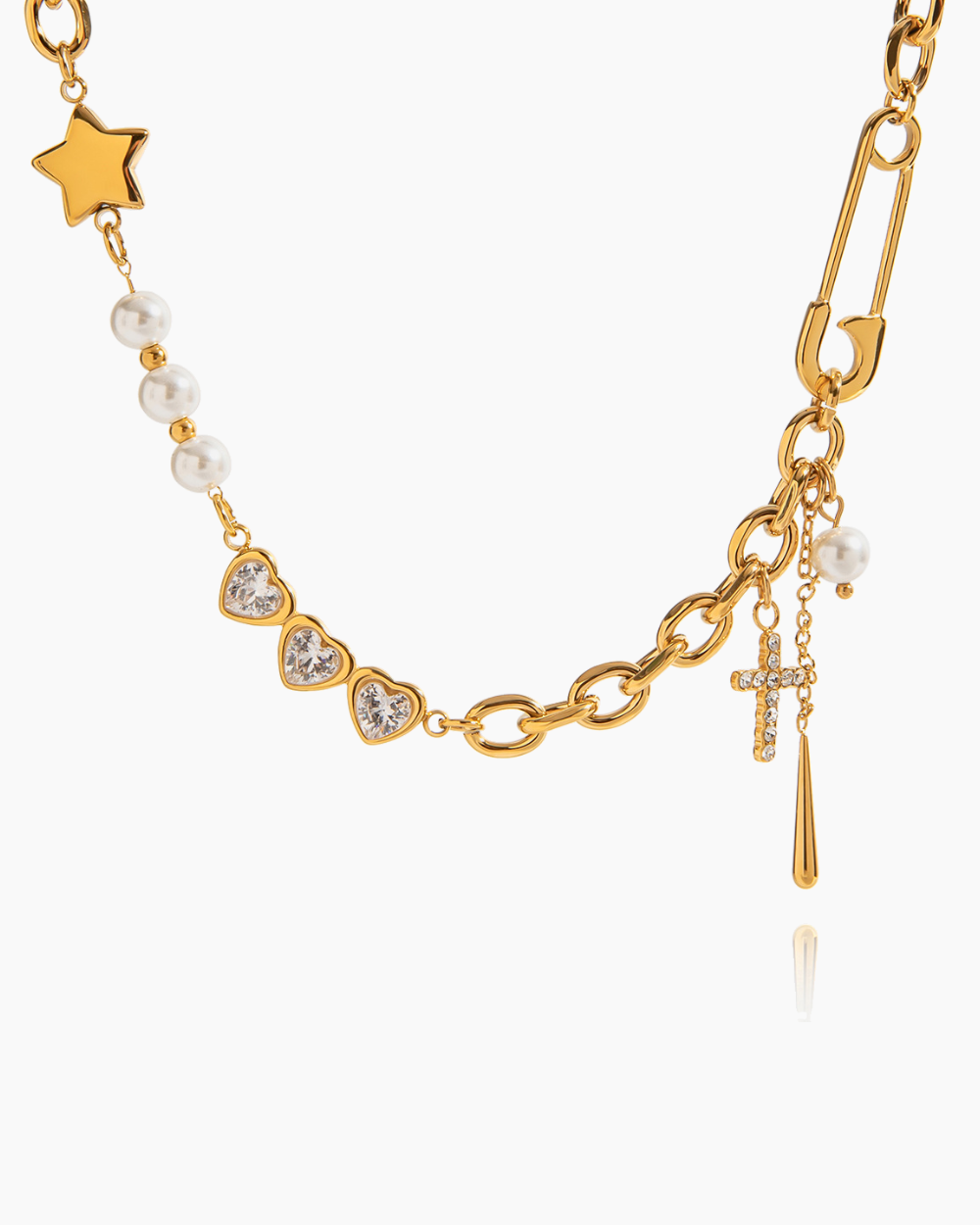 Gold necklace with various charms on a white background
