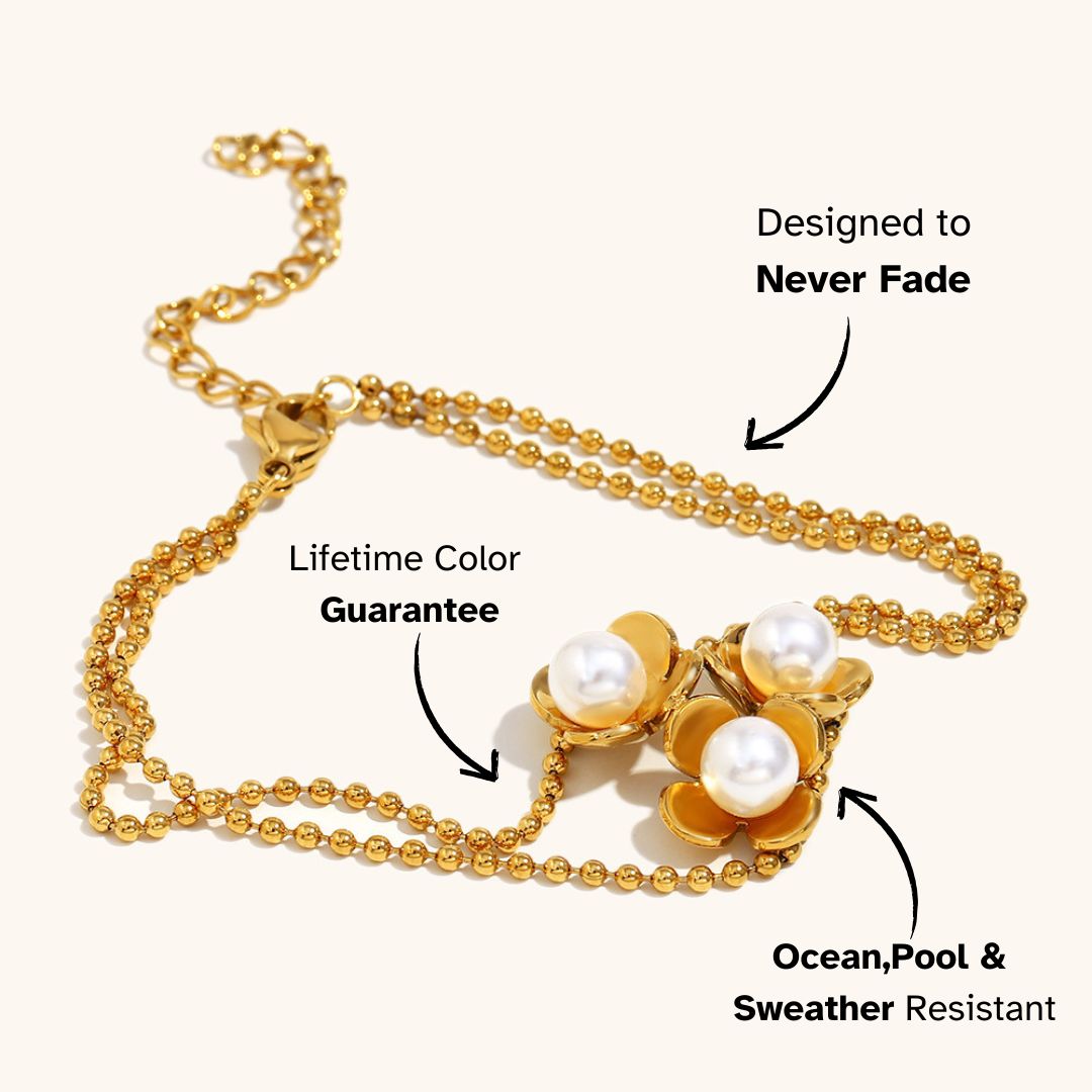 Bold gold bracelet with three blooming pearl flowers, ideal for evening wear or holiday dressing, sweatproof and non-tarnish