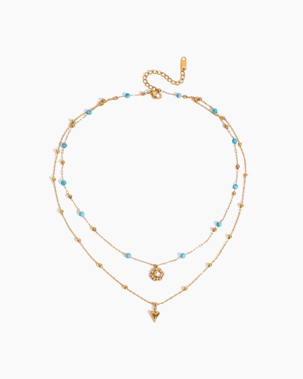 Two layered gold necklaces with blue beads on a white background