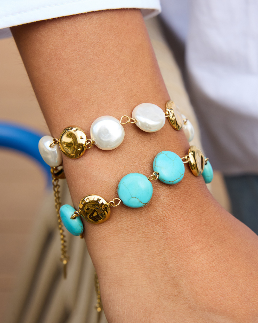 Bracelet with pearls and turquoise beads on a wrist