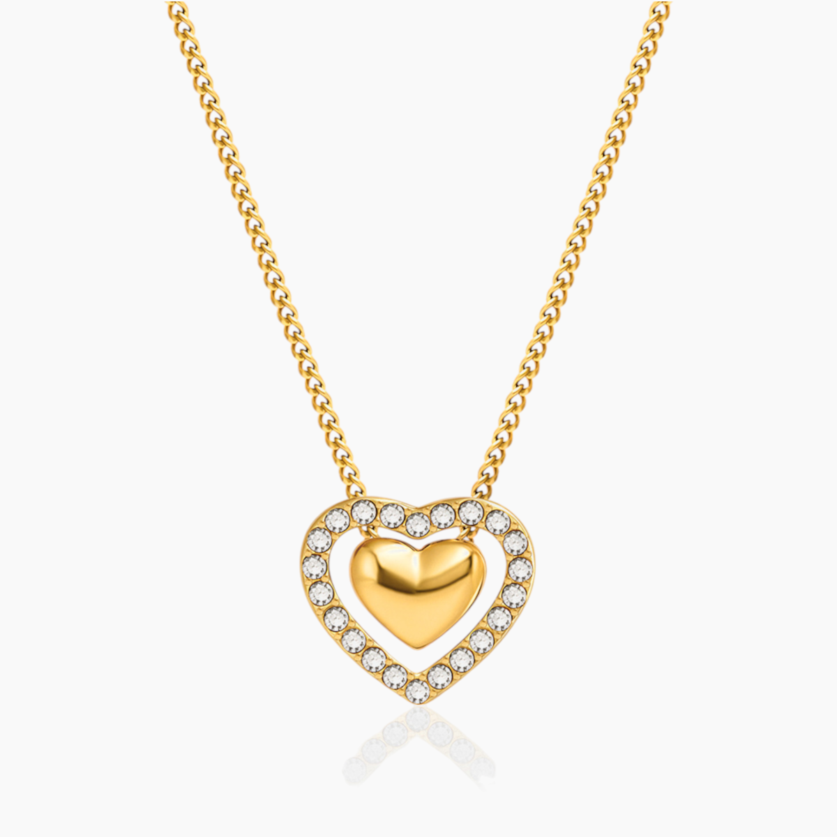 Gold heart-shaped necklace with embedded stones on a white background