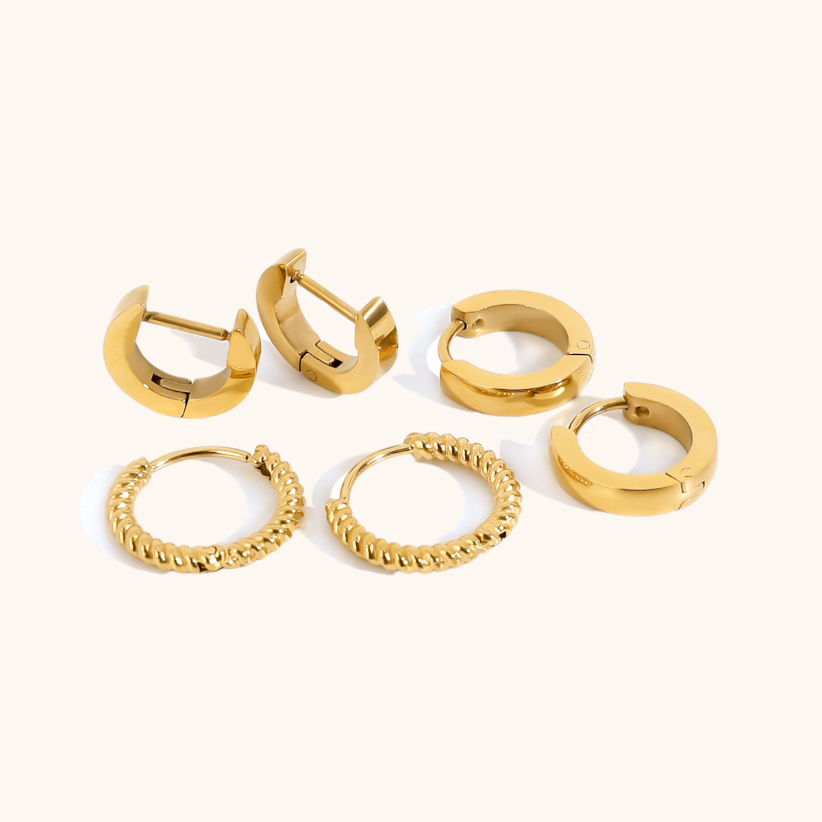 Close-up of twisted rope gold hoop earrings with waterproof and tarnish-resistant finish