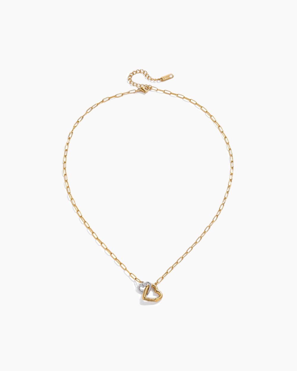 Gold necklace with a heart-shaped pendant on a white background
