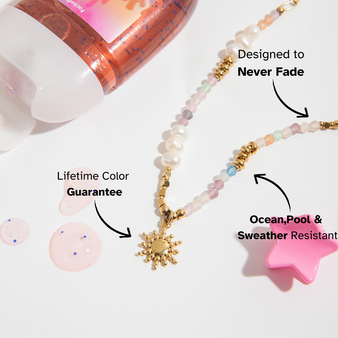 Sunburst charm gold necklace styled with summer layers
