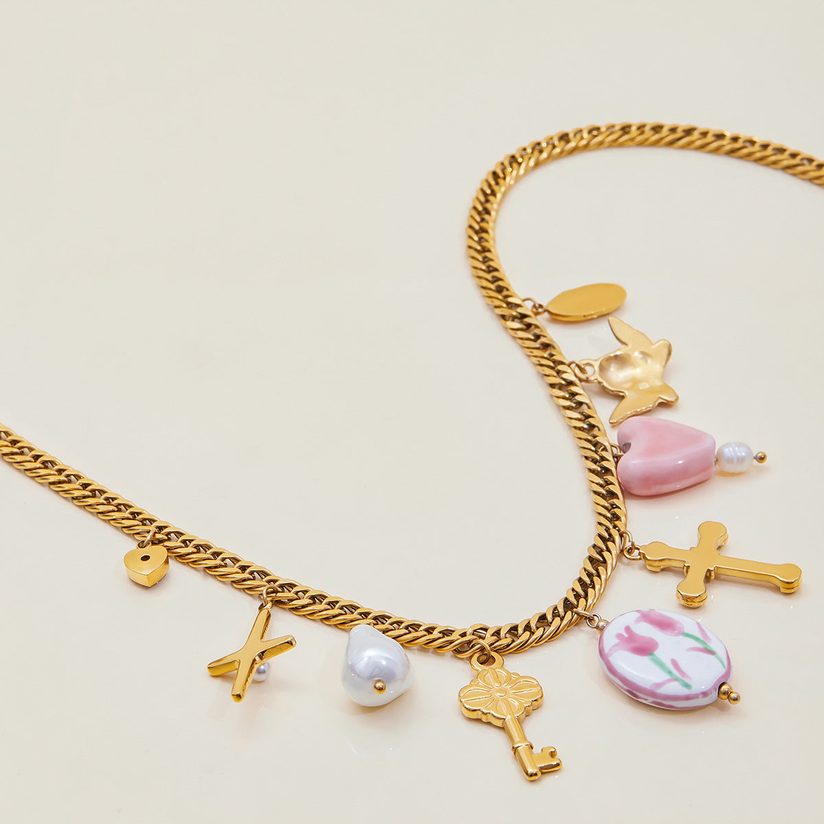 Detail shot of whimsical gold pendant necklace for summer outfits