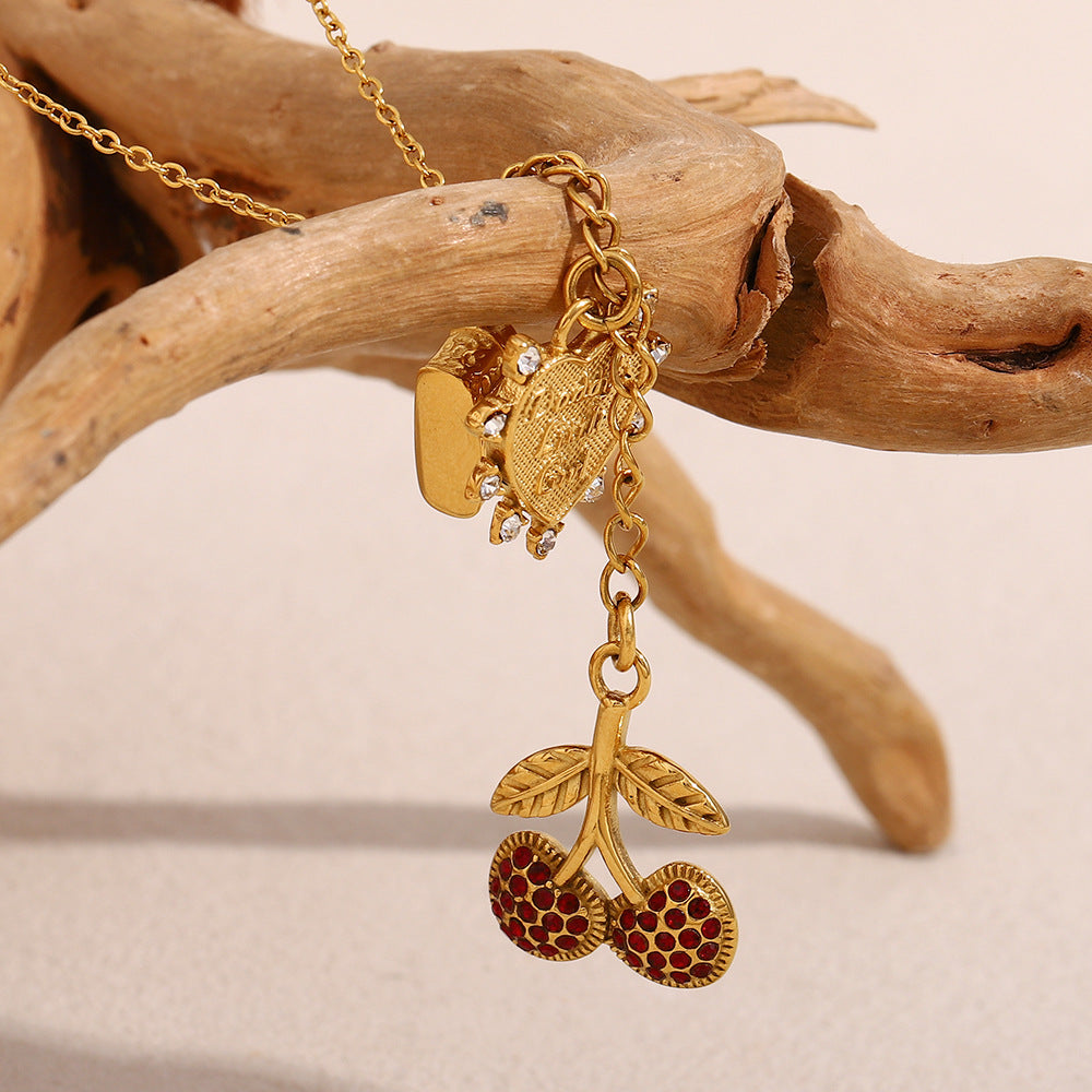 vintage gold necklace with camera and heart pendant