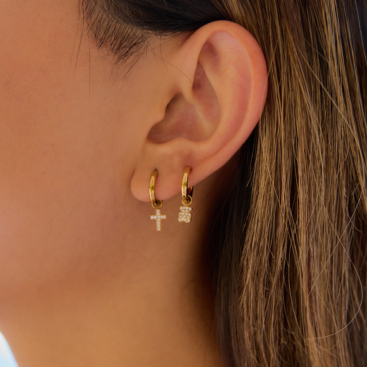 Minimalist waterproof gold earrings styled with casual look