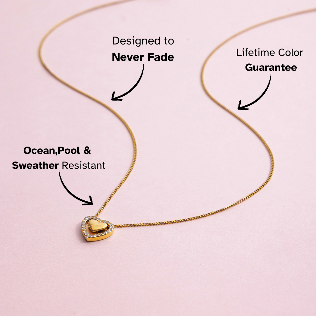 Gold necklace with a heart pendant on a pink background, featuring text about its features.