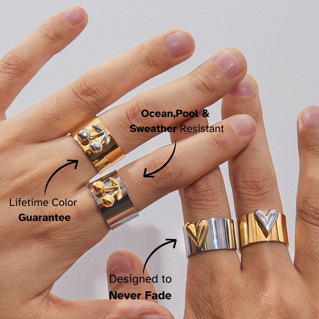Gold and silver cherry rings stacked on fingers, lifetime color guarantee