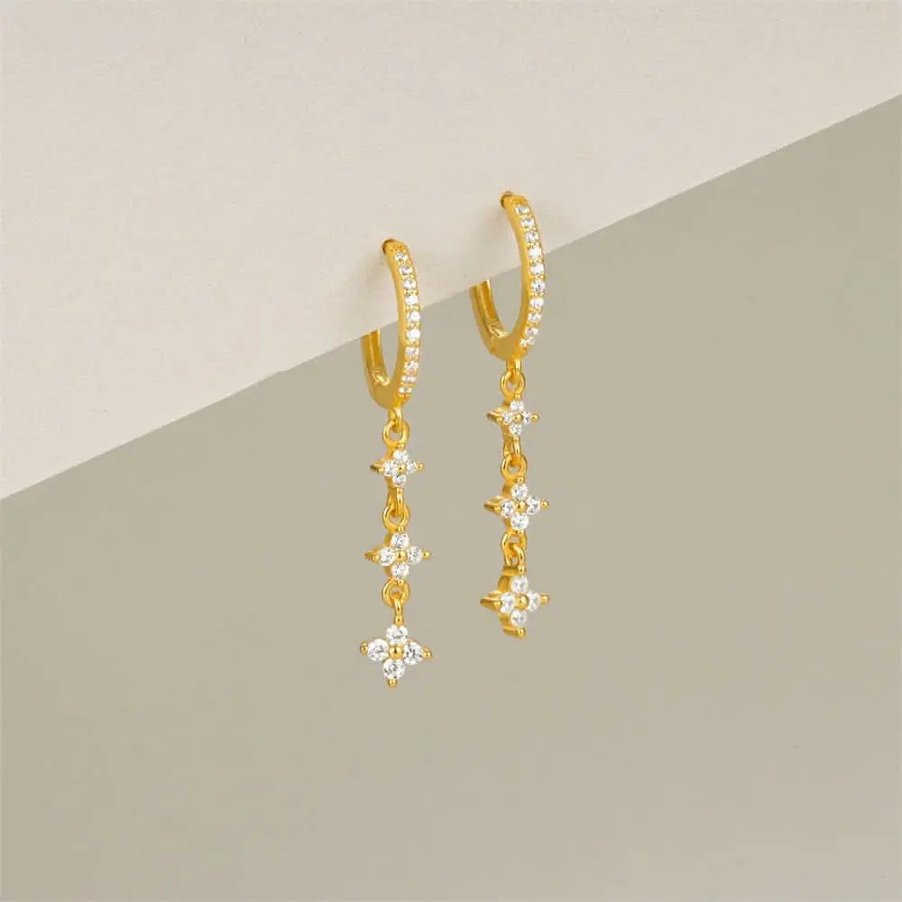 Diamond star dangle earrings, ideal for sensitive ears with a stunning gold design.