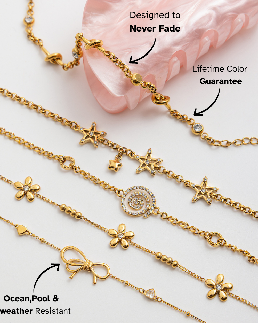 Gold bracelets with various charms on a light background