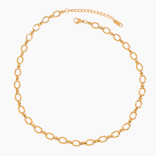 Gold chain necklace on a white background
