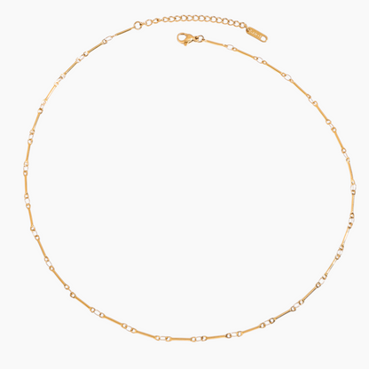 Gold chain necklace on a white background