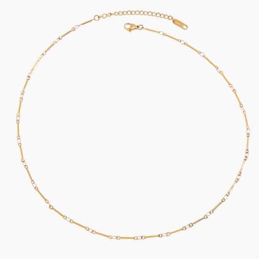 Gold chain necklace on a white background