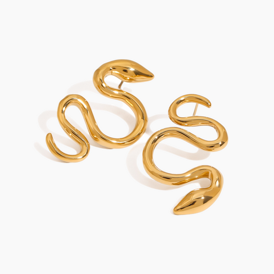 Gold snake-shaped earrings on a white background