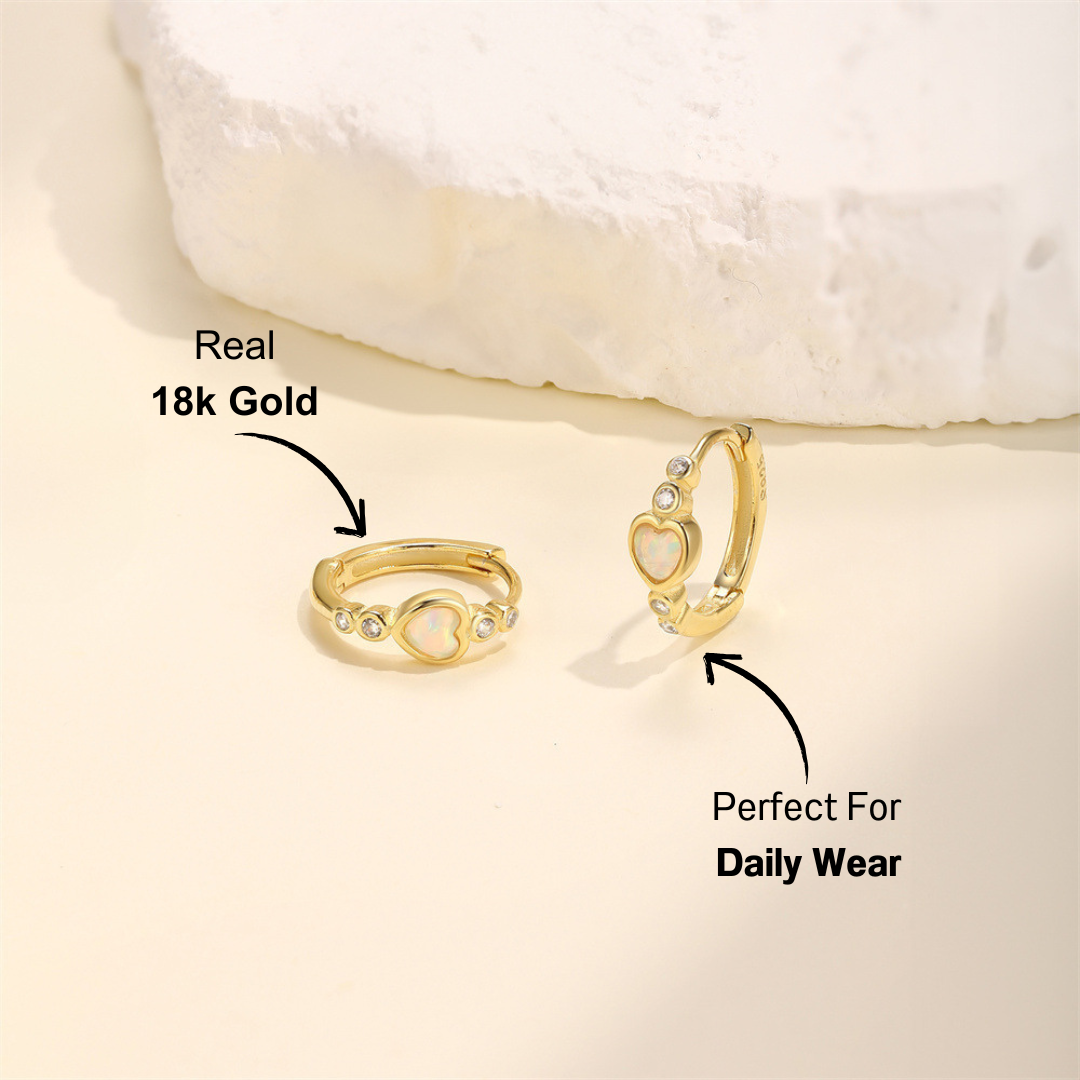 14k gold-plated heart opal hoop earrings with zirconia accents, displayed on a soft background.