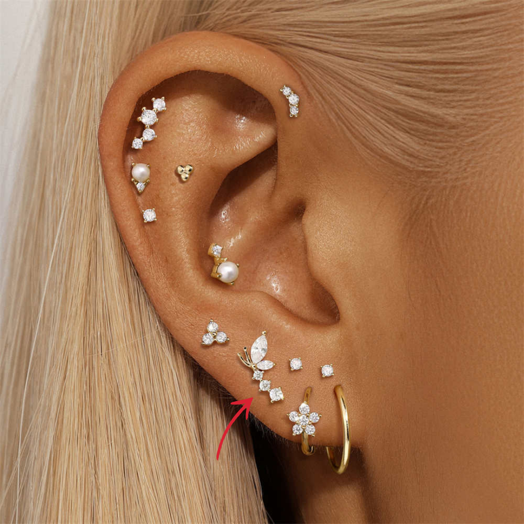  Delicate butterfly earring in 14K gold, embellished with marquise and round-cut zirconia stones.