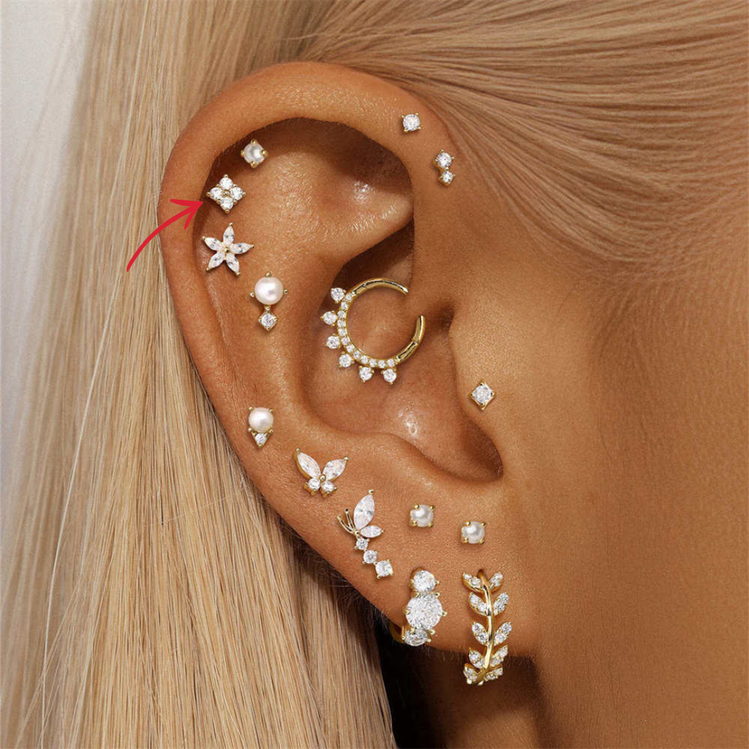 Model wearing 14K gold zirconia floral stud earrings, showing the elegance and shine of the design.