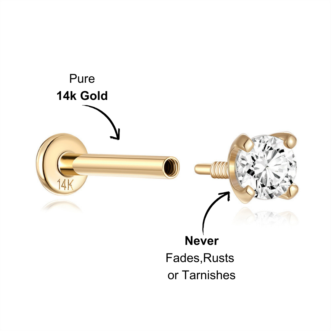 Elegant 14K gold zirconia round stud earring styled with other delicate gold earrings in a modern ear stack.