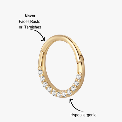 Side view of a 14K gold huggie hoop earring adorned with cubic zirconia stones, showcasing its brilliance and modern style.