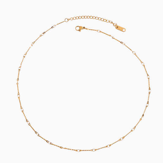 Gold chain necklace on a white background