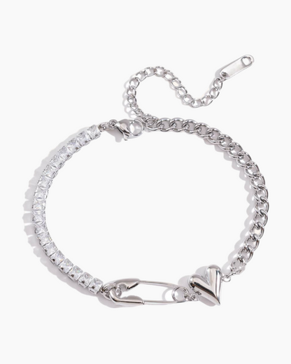 Silver bracelet with clear stones on a white background