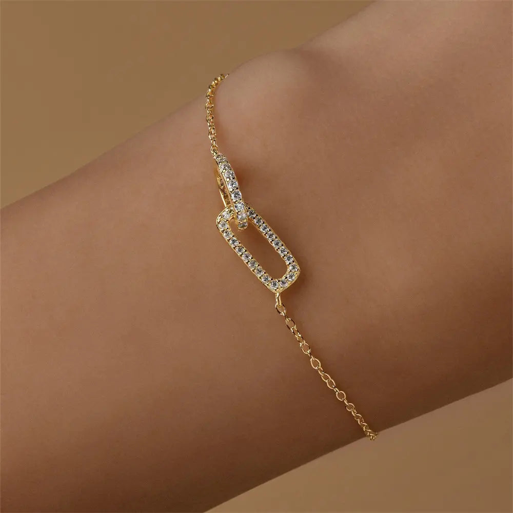 Model showcasing a 925 sterling silver bracelet with a zircon-studded link, adding a touch of sparkle to the wrist.